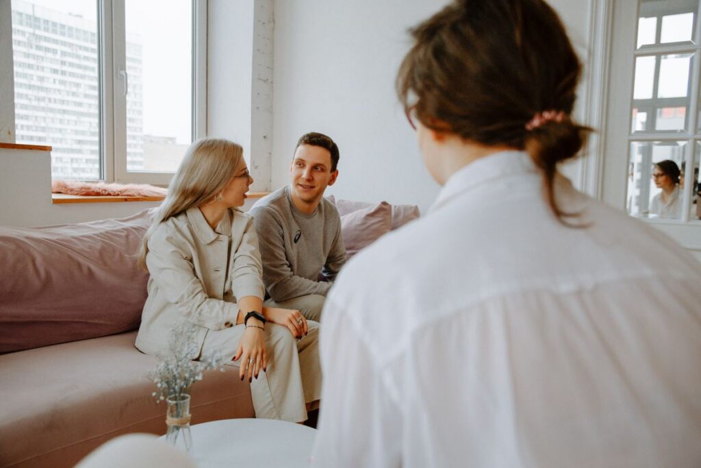A couple talking with a therapist during a therapy session